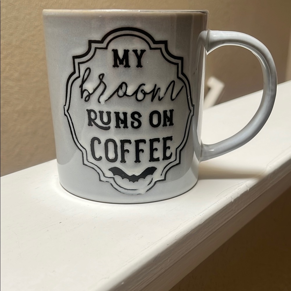 Broom runs on coffee mug